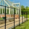 Estate Fencing running past a greenhouse
