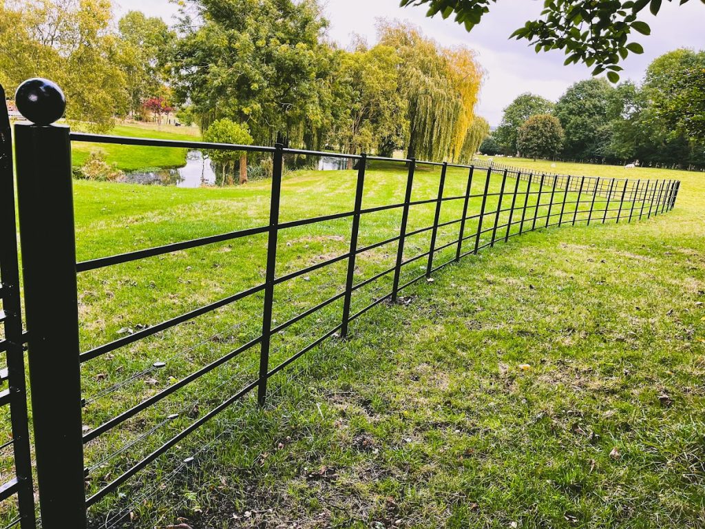 Steel estate fencing in a garden.